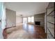 Bright living room featuring a brick fireplace, sliding glass doors to outdoor living and tiled flooring at 4916 E Hopi St, Phoenix, AZ 85044