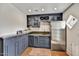 Bar area features custom cabinets, granite counters, a copper sink, and stainless steel refrigerator at 5112 N 41St St, Phoenix, AZ 85018