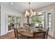 Cozy dining area with a round table set for four, surrounded by large windows offering natural light at 5112 N 41St St, Phoenix, AZ 85018