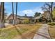 Charming single-story home with mature trees and a lush green lawn at 5112 N 41St St, Phoenix, AZ 85018