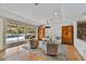 Bright living room featuring hardwood floors, comfortable seating, and pool access at 5112 N 41St St, Phoenix, AZ 85018