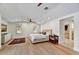 Spacious bedroom with hardwood floors, natural light, and modern ceiling fan at 5112 N 41St St, Phoenix, AZ 85018