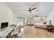 Spacious bedroom with hardwood floors, natural light, and modern ceiling fan at 5112 N 41St St, Phoenix, AZ 85018