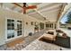 Covered patio boasts comfortable seating, ceiling fans, and an outdoor television for relaxation and entertainment at 5112 N 41St St, Phoenix, AZ 85018