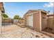 Backyard featuring a shed, pool, and concrete patio area surrounded by block fencing at 5525 N 21St Ave, Phoenix, AZ 85015