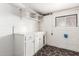 Basement featuring white painted brick walls, storage shelves and a window at 5525 N 21St Ave, Phoenix, AZ 85015