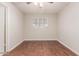 A bedroom with wood flooring, a ceiling fan, and a window at 5525 N 21St Ave, Phoenix, AZ 85015