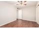 A bedroom with wood flooring, ceiling fan, and closet at 5525 N 21St Ave, Phoenix, AZ 85015