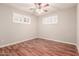 A bedroom features wood floors and window shutters at 5525 N 21St Ave, Phoenix, AZ 85015