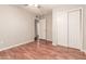 A bedroom features wood floors, ceiling fan, and closet at 5525 N 21St Ave, Phoenix, AZ 85015