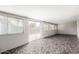 Enclosed sunroom features large windows and stone tile flooring at 5525 N 21St Ave, Phoenix, AZ 85015