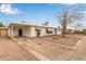 View of single story home with covered parking, neutral desert landscaping and awnings on the windows at 5525 N 21St Ave, Phoenix, AZ 85015