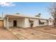 View of single story home with covered parking, neutral desert landscaping and awnings on the windows at 5525 N 21St Ave, Phoenix, AZ 85015
