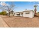 View of single story home with neutral desert landscaping and awnings on the windows at 5525 N 21St Ave, Phoenix, AZ 85015