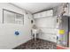Laundry room with brick walls, a utility sink, and a water heater at 5525 N 21St Ave, Phoenix, AZ 85015