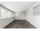 Bright living room with geometric patterned tile flooring and neutral walls at 5525 N 21St Ave, Phoenix, AZ 85015