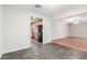 Open living area leads to kitchen with tile floors and neutral walls at 5525 N 21St Ave, Phoenix, AZ 85015