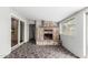 Bright living room features brick fireplace and geometric patterned tile flooring at 5525 N 21St Ave, Phoenix, AZ 85015