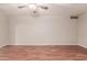 Spacious living room with wood floors, neutral walls and ceiling fan at 5525 N 21St Ave, Phoenix, AZ 85015