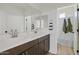 Stylish bathroom featuring a double vanity with modern faucets and decorative shower curtain at 5650 S Feliz --, Mesa, AZ 85212