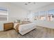 Serene bedroom with neutral tones, multiple windows, and a cozy rug at 5650 S Feliz --, Mesa, AZ 85212