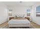 Bright bedroom with a neutral color scheme, soft rug, and natural light at 5650 S Feliz --, Mesa, AZ 85212