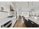 Modern kitchen with a view into the breakfast nook and great room area at 5650 S Feliz --, Mesa, AZ 85212