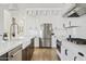 Updated kitchen featuring stainless steel appliances, white cabinets, and a stylish backsplash at 5650 S Feliz --, Mesa, AZ 85212