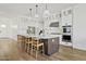 Spacious kitchen with a large island, modern appliances, and white cabinetry at 5650 S Feliz --, Mesa, AZ 85212