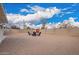 View of the backyard that includes a fire pit, seating, and a rock groundcover with a block wall at 6119 N 18Th Dr, Phoenix, AZ 85015