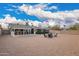 Expansive backyard featuring a covered patio, rock groundcover, and a cozy fire pit with comfortable seating at 6119 N 18Th Dr, Phoenix, AZ 85015
