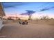 Backyard view with chairs and firepit, rock groundcover, and a block wall at 6119 N 18Th Dr, Phoenix, AZ 85015