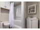 Bathroom with tub and vanity with storage at 6119 N 18Th Dr, Phoenix, AZ 85015