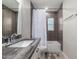 Updated bathroom with gray backsplash and gray countertops at 6119 N 18Th Dr, Phoenix, AZ 85015