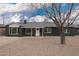 Charming single-story home with a well-maintained front yard, featuring a classic design and desert landscaping at 6119 N 18Th Dr, Phoenix, AZ 85015