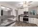 Modern kitchen featuring stainless steel appliances, granite countertops and wood-look tile at 6119 N 18Th Dr, Phoenix, AZ 85015