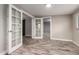 Open-concept living room with wood-look tile flooring and open doorway at 6119 N 18Th Dr, Phoenix, AZ 85015