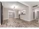 Open-concept living area features wood-look floors and lots of natural light at 6119 N 18Th Dr, Phoenix, AZ 85015
