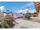 Serene backyard with gravel, patio furniture, desert landscaping, and a Scottsdale wall mural at 6943 E Granada Rd, Scottsdale, AZ 85257