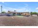 Charming single-story home featuring a low-maintenance yard, putting green, and covered patio for outdoor living at 6943 E Granada Rd, Scottsdale, AZ 85257