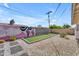 Backyard features a bocce ball court, white rock landscaping, and a Scottsdale mural at 6943 E Granada Rd, Scottsdale, AZ 85257