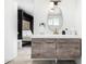 Elegant bathroom with a sleek vanity, modern fixtures, and a stylish oval mirror at 6943 E Granada Rd, Scottsdale, AZ 85257