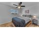 Bedroom featuring a plush bed, modern furniture, and natural light at 6943 E Granada Rd, Scottsdale, AZ 85257
