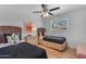 Neutral guest bedroom features twin beds and a wooden nightstand with drawers at 6943 E Granada Rd, Scottsdale, AZ 85257