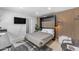 Studio bedroom with a murphy bed, potted plant, and side chairs at 6943 E Granada Rd, Scottsdale, AZ 85257