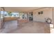 Spacious covered carport featuring a brick BBQ, ceiling fans, and plenty of room for outdoor entertaining at 6943 E Granada Rd, Scottsdale, AZ 85257
