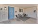 Welcoming front porch with stylish seating and a charming blue front door at 6943 E Granada Rd, Scottsdale, AZ 85257