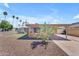 Inviting home featuring low maintenance desert landscaping, a carport, and a cozy front patio at 6943 E Granada Rd, Scottsdale, AZ 85257