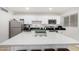 Bright kitchen with a center island, stainless steel appliances, and ample countertop space at 6943 E Granada Rd, Scottsdale, AZ 85257