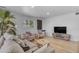 Inviting living room with cozy seating, stylish decor, and a mounted television at 6943 E Granada Rd, Scottsdale, AZ 85257